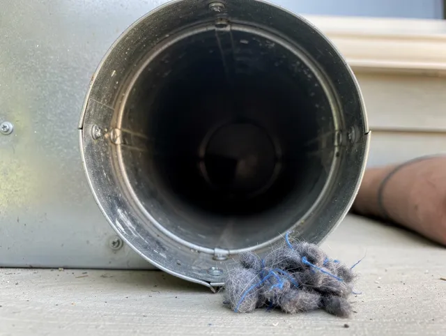 Culver City Dryer Vent Cleaning technician using specialized equipment to clear severe dryer vent blockage in Culver City
